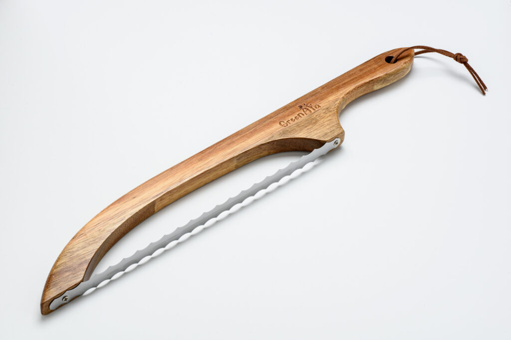 Bread knife with curved wooden handle and stainless steel blade isolated on a white background