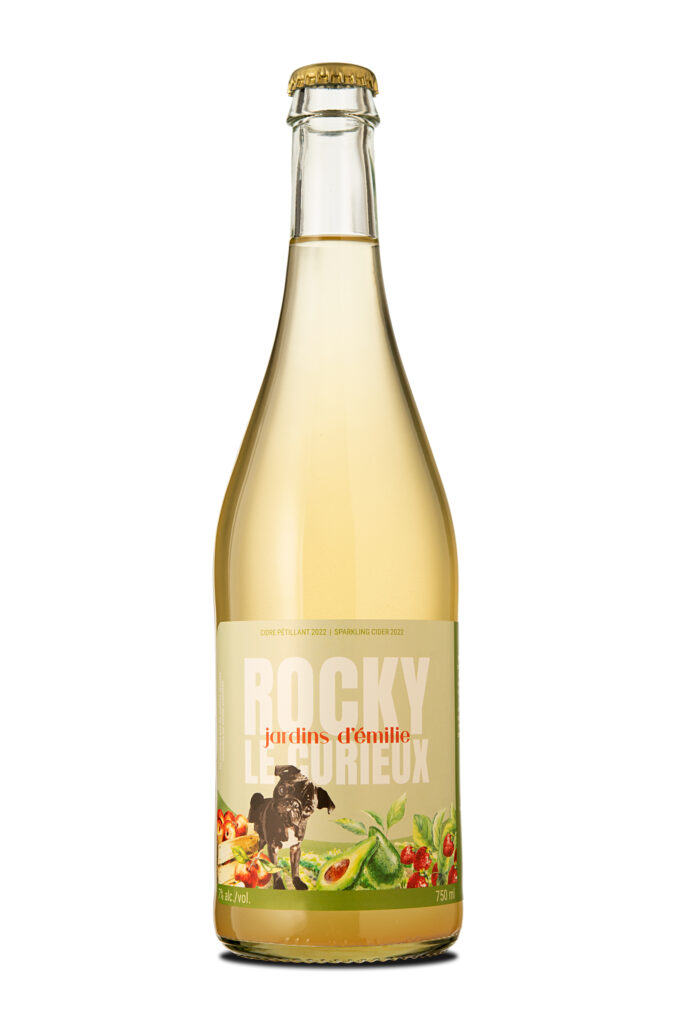 Studio bottle of Rocky sparkling cider with illustrated label and fruit accents